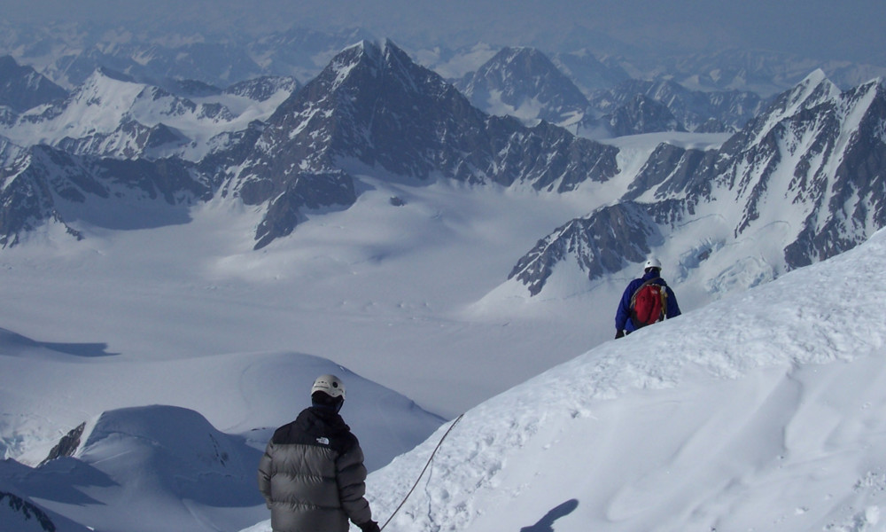 Descending from the summit with Mt. Watson in the background