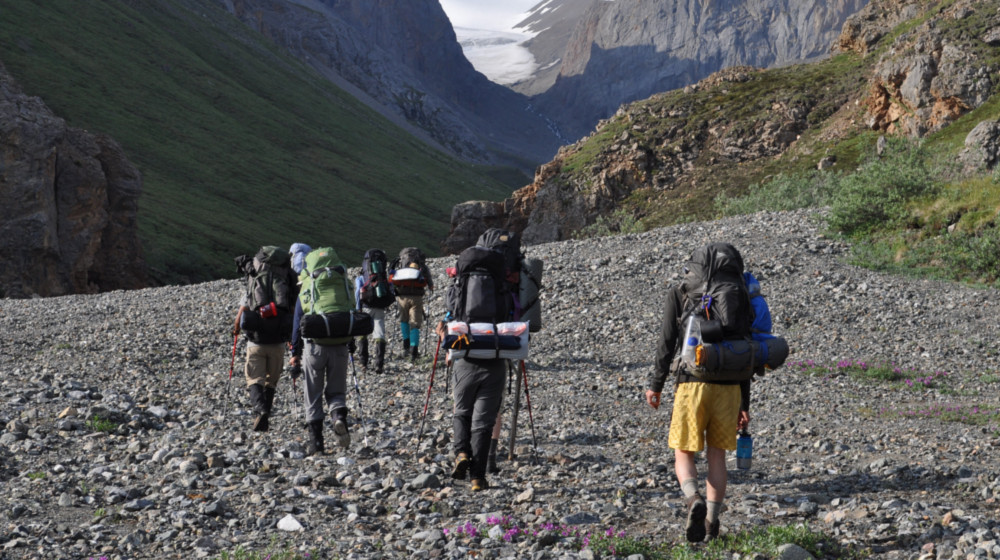 After crossing the tundra flats of Burwash Landing, a group approaches Hoge Pass