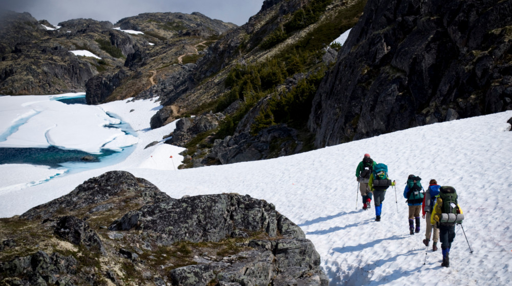 Early season hikes on the Chilkoot often have snow fields near the pass